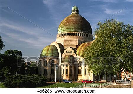 Stock Photography - Cars parked in front of church, Belgium . Fotosearch
