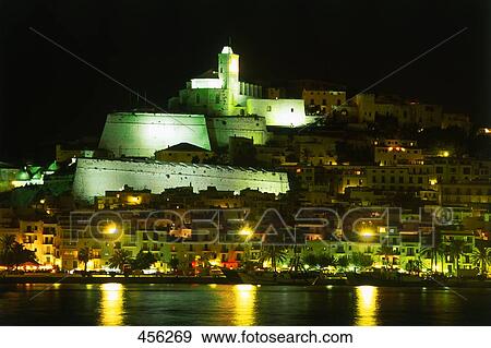 Castle on hill at coast lit up at night, Ibiza Isla, Balearic Islands, Spain View Large Photo Image Stock Photo - Castle on hill at coast lit up at night, Ibiza Isla, Balearic Islands, Spain . Fotosearch