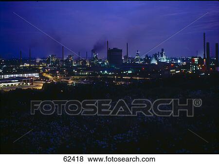 Chemical plant illuminated at night View Large Photo Image Stock Photo - Chemical plant illuminated at night . Fotosearch