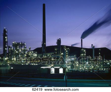 Chemical plant illuminated at night View Large Photo Image Stock Photo - Chemical plant illuminated at night . Fotosearch