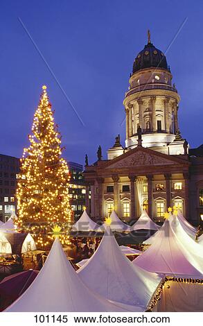 Christmas market in front of lit up church at dusk, Gendarmenmarkt, Berlin, Germany View Large Photo Image Stock Photography - Christmas market in front of lit up church at dusk, Gendarmenmarkt, Berlin, Germany . Fotosearch