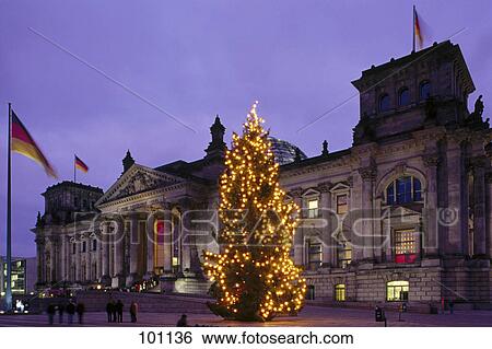 Stock Photograph - Christmas tree lit up in front of parliament building, Berlin, Germany . Fotosearch
