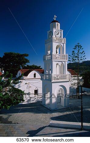 Church clock tower against blue sky, Agias Trias Church, Rhodes, Dodecanese Islands, Greece View Large Photo Image Stock Image - Church clock tower against blue sky, Agias Trias Church, Rhodes, Dodecanese Islands, Greece . Fotosearch