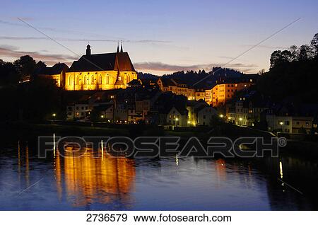 Church lit up at dusk, St. Laurentius Church, Saarburg, Rhineland-Palatinate, Germany View Large Photo Image Stock Photo - Church lit up at dusk, St. Laurentius Church, Saarburg, Rhineland-Palatinate, Germany . Fotosearch