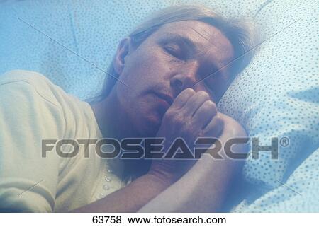 Close-up of a senior woman sleeping View Large Photo Image Stock Photo - Close-up of a senior woman sleeping . Fotosearch
