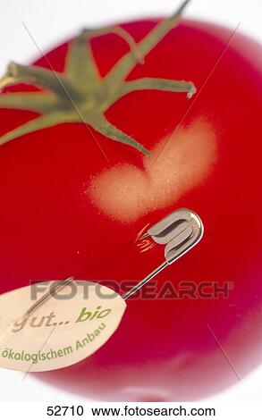 Stock Image - Close-up of an organic tomato . Fotosearch