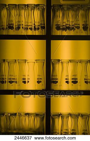 Close-up of beer glasses on shelves View Large Photo Image Stock Photo - Close-up of beer glasses on shelves . Fotosearch
