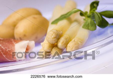 Close-up of boiled asparagus and potatoes on plate View Large Photo Image Stock Photograph - Close-up of boiled asparagus and potatoes on plate . Fotosearch