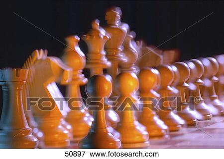 Close-up of chess pieces on chessboard View Large Photo Image Stock Photo - Close-up of chess pieces on chessboard . Fotosearch