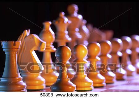 Close-up of chess pieces on chessboard View Large Photo Image Stock Photo - Close-up of chess pieces on chessboard . Fotosearch