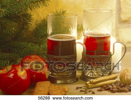 Close-up of cups of tea with red apples near a Christmas tree View Large Photo Image Stock Photo - Close-up of cups of tea with red apples near a Christmas tree . Fotosearch