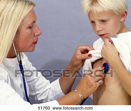Stock Image - Close-up of female doctor examining boy with stethoscope . Fotosearch