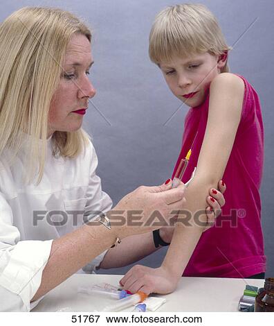 Stock Photo - Close-up of female doctor taking blood sample from boy's arms . Fotosearch