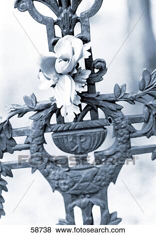 Stock Photo - Close-up of flower and crucifix . Fotosearch