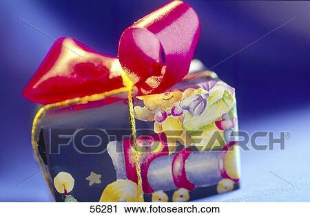 Stock Image - Close-up of gift wrapped with wrapping paper . Fotosearch