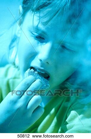 Close-up of girl eating cookie View Large Photo Image Stock Image - Close-up of girl eating cookie . Fotosearch