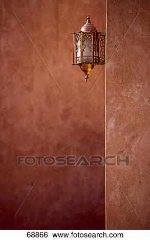 Stock Photograph - Close-up of lantern on wall . Fotosearch