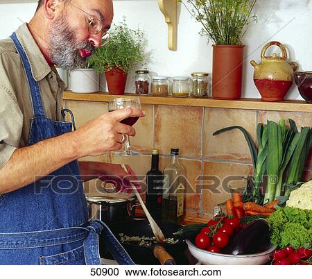 Close-up of man preparing food in kitchen View Large Photo Image Stock Image - Close-up of man preparing food in kitchen . Fotosearch
