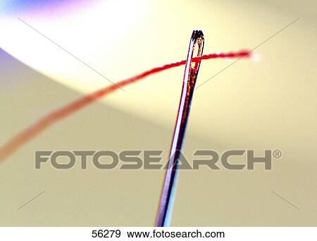 Close-up of needle and thread View Large Photo Image Stock Photo - Close-up of needle and thread . Fotosearch