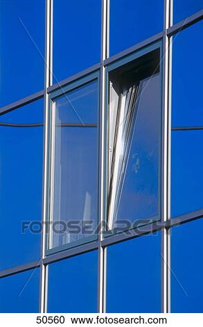 Stock Image - Close-up of opened window of office building . Fotosearch