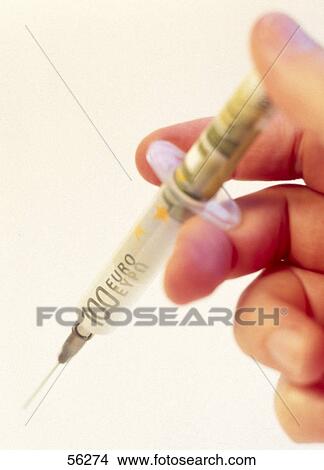 Close-up of person's holding syringe with one hundred Euro banknote View Large Photo Image Picture - Close-up of person's holding syringe with one hundred Euro banknote . Fotosearch