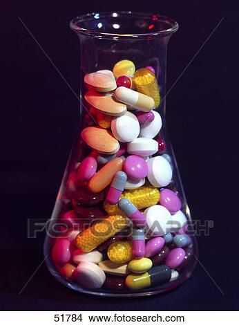 Close-up of pills and capsules in beaker View Large Photo Image Picture - Close-up of pills and capsules in beaker . Fotosearch