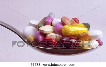 Close-up of pills and capsules on spoon View Large Photo Image Stock Image - Close-up of pills and capsules on spoon . Fotosearch