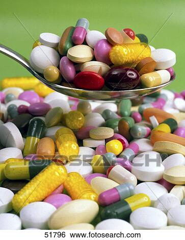 Close-up of pills and capsules on spoon View Large Photo Image Stock Photograph - Close-up of pills and capsules on spoon . Fotosearch