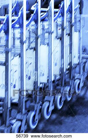 Close-up of row of luggage carts at airport View Large Photo Image Stock Photo - Close-up of row of luggage carts at airport . Fotosearch