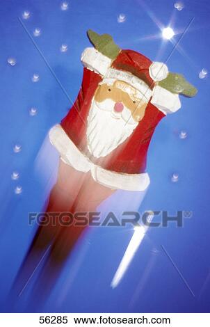 Close-up of santa claus flying View Large Photo Image Stock Photography - Close-up of santa claus flying . Fotosearch