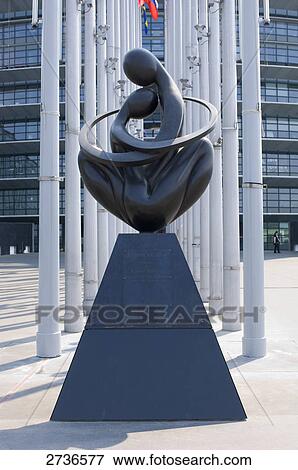 Close-up of statue in front of building View Large Photo Image Stock Photo - Close-up of statue in front of building . Fotosearch