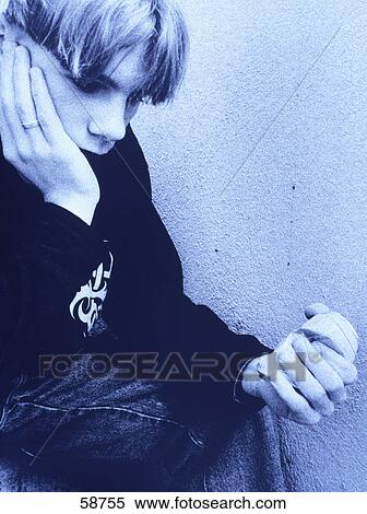 Close-up of teenage boy thinking View Large Photo Image Stock Photography - Close-up of teenage boy thinking . Fotosearch