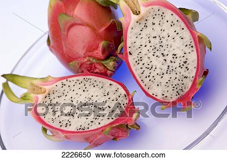 Close-up of two halves of pitaya on plate View Large Photo Image Stock Image - Close-up of two halves of pitaya on plate . Fotosearch