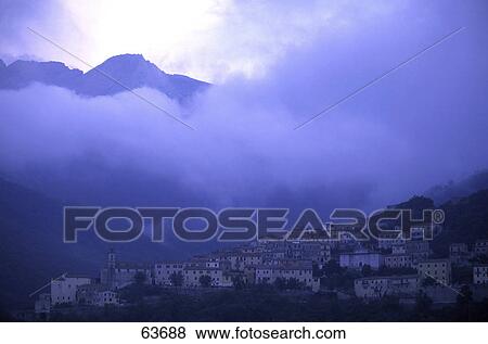 Clouds above town on mountain, Mt Capanne, Elba Island, Tuscany, Italy View Large Photo Image Stock Photo - Clouds above town on mountain, Mt Capanne, Elba Island, Tuscany, Italy . Fotosearch