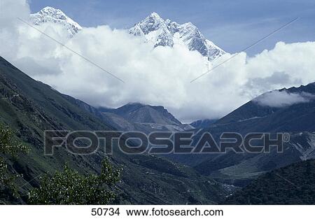 Clouds around mountain peaks, Lhotse, Mt Everest, Himalayas, Nepal View Large Photo Image Picture - Clouds around mountain peaks, Lhotse, Mt Everest, Himalayas, Nepal . Fotosearch