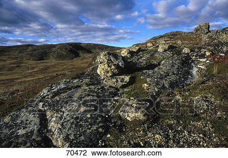 Stock Image - Clouds over landscape . Fotosearch