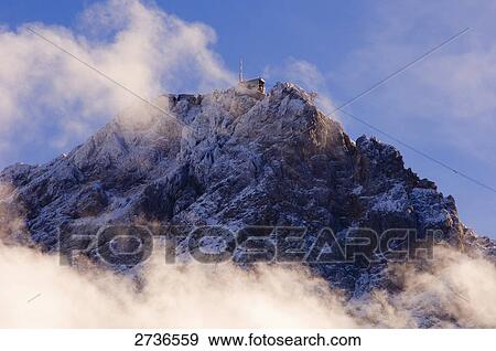 Clouds over mountain, Mt Zugspitze, Germany View Large Photo Image Stock Photo - Clouds over mountain, Mt Zugspitze, Germany . Fotosearch