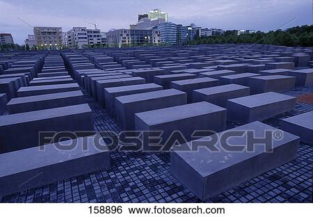 Concrete steles at memorial with buildings in background, Holocaust Memorial, Berlin, Germany View Large Photo Image Stock Photograph - Concrete steles at memorial with buildings in background, Holocaust Memorial, Berlin, Germany . Fotosearch