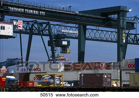 Stock Photography - Container ship and crane at harbor, Dusseldorf, Germany . Fotosearch