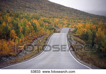 Country road passing through landscape View Large Photo Image Stock Image - Country road passing through landscape . Fotosearch