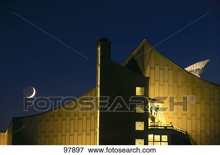 Stock Photo - Crescent moon over concert hall, Berliner Philharmonie, Berlin, Germany . Fotosearch