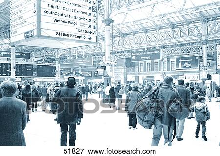 Crowd of people in railway station, Victoria Station, London, England View Large Photo Image Stock Photo - Crowd of people in railway station, Victoria Station, London, England . Fotosearch