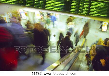 Crowd of people on escalator at airport View Large Photo Image Stock Image - Crowd of people on escalator at airport . Fotosearch