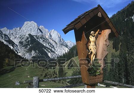 Crucifix with mountains in background, Bavarian Alps, Bavaria, Germany View Large Photo Image Stock Image - Crucifix with mountains in background, Bavarian Alps, Bavaria, Germany . Fotosearch