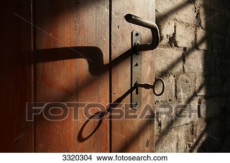 Doorlock of an old wooden door, low angle view View Large Photo Image Picture - Doorlock of an old wooden door, low angle view . Fotosearch