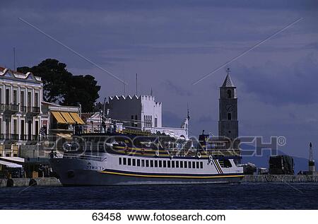 Ferry passing buildings on riverside View Large Photo Image Stock Photo - Ferry passing buildings on riverside . Fotosearch