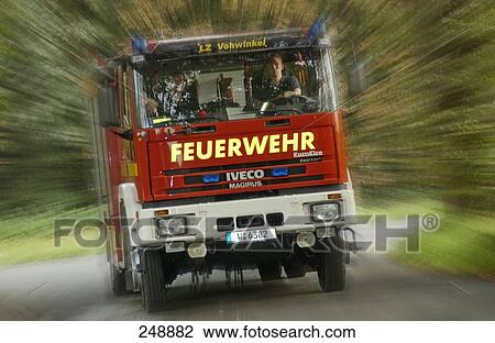 Fire engine in motion on country road View Large Photo Image Stock Image - Fire engine in motion on country road . Fotosearch