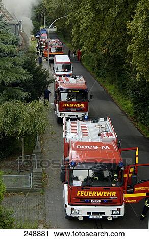 Fire engines parked in row View Large Photo Image Stock Image - Fire engines parked in row . Fotosearch