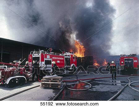 Fire fighters beside fire truck View Large Photo Image Stock Image - Fire fighters beside fire truck . Fotosearch