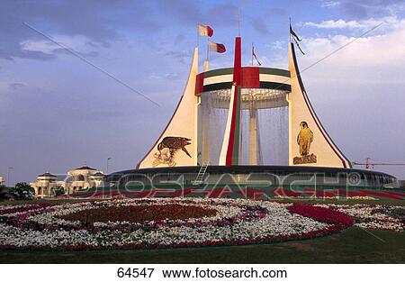 Flags hoisted on water fountain as seen amidst lawn, Abu Dhabi, United Arab Emirates View Large Photo Image Stock Photo - Flags hoisted on water fountain as seen amidst lawn, Abu Dhabi, United Arab Emirates . Fotosearch